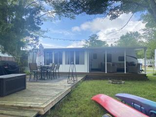 Waterfront 33 ft Jayco Jay Flight with 3 Season Room Divided Into 2 Bedrooms